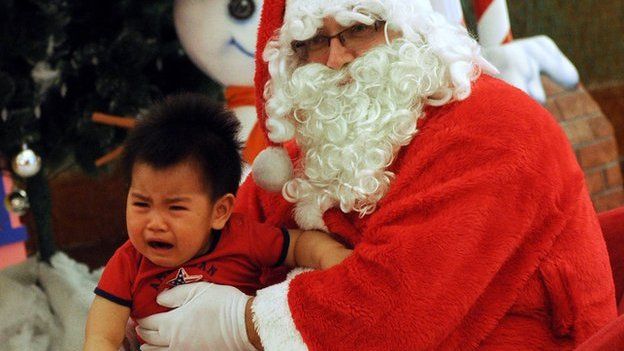 Santa with crying child