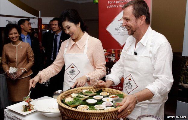 Prime Minister of Thailand, Ms Yingluck Shinawatra and Australian chef David Thompson cook traditional Thai food during a Thai food promotion and cooking demonstration at the Shangri-La Hotel on 27 May 2012 in Sydney, Australia