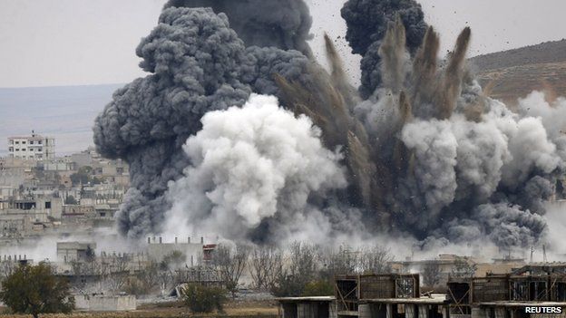 An explosion following an air strike in central Kobane in Syria (17 November 2014)