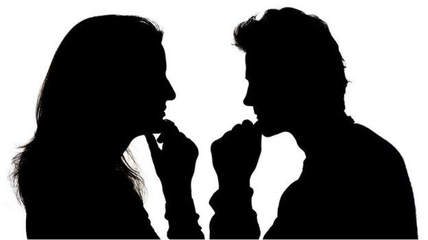 A man and a woman in silhouette