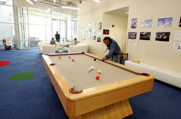 Man plays pool at Google offices
