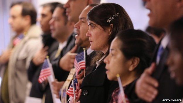 Immigrants take oath of citizenship to the United States on November 20, 2014 in Newark, New Jersey