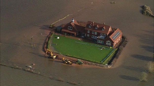 House surrounded by floodwater in the Somerset Levels
