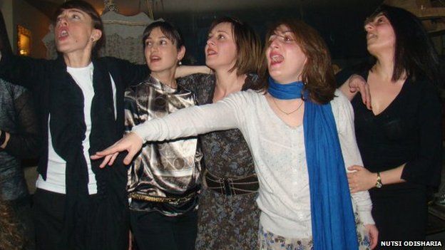 Women singing in karaoke club in Georgia