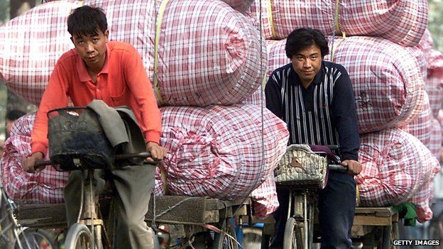 Cyclists with heavy loads in China