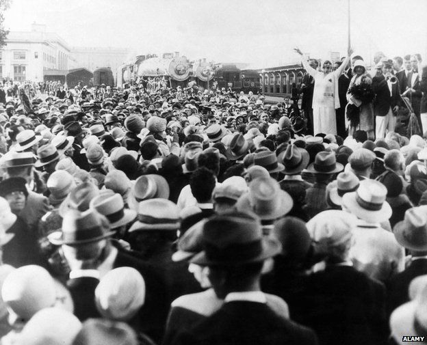 Aimee Semple McPherson (far right, standing with raised arms), c. 1930