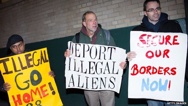 Three men protest President Obama's immigration action in New York City