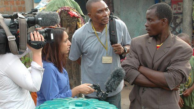 The BBC interview a man in Maferiah, Guinea, 21 November 2014