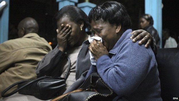 Relatives of those who were killed cry as the bodies of their loved ones arrive at Chiromo mortuary in Nairobi, Kenya - 22 November 2014