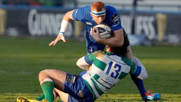 Leinster try-scorer Darragh Fanning is tackled by Treviso's Enrico Bacchin
