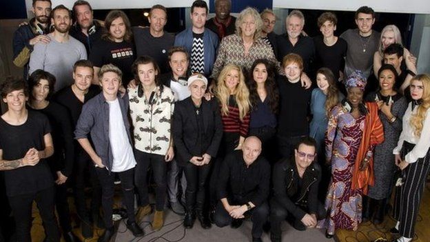 Band Aid 30 artists recording a new version of the song Do They Know It?s Christmas?, to be released in order to raise money for charity, specifically the ebola crisis in west Africa, SARM Studios, Notting Hill, London, UK, 15.11.2014. the group line up.Top Row L-R: Kyle Simmons (Bastille), William Farquarson (Bastille), Guy Garvey (Elbow), Chris "Woody" Wood (Bastille), Chris Martin, Dan Smith (Bastille), Seal, Sir Bob Geldof, Karl Hyde (Underworld), Roger Taylor, Joe Suggs (Thatcher Joe Youtube), Alfie Deyes (Youtube), Milan Neil Amin-Smith (Clean Bandit) and Grace Chatto (Clean Bandit) Second Row L-R Louis Tomlinson, Zayn Malik, Liam Payne, Niall Horan, Harry Styles, Olly Murs, Sinead O"Connor, Ellie Goulding, Jessie Ware, Ed Sheeran, Zoella (Youtube), Angelique Kidjo, Emeli Sande, Paloma Faith.Front Row crouching L-R Midge Ure, Bono