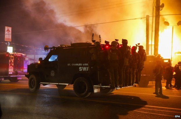 Riot police on a vehicle in Ferguson, 24 November