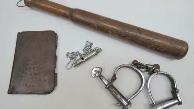 A notebook cover, truncheon, whistle and handcuffs that belonged to PC Edward Watkins