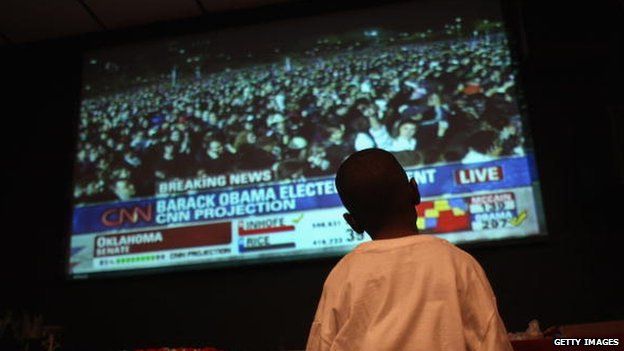 A young boy watches Obama's election night November 2008