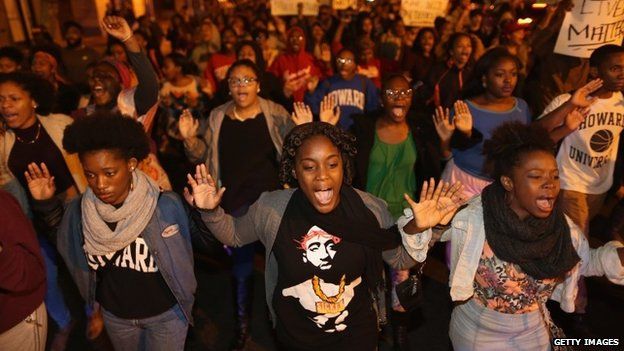 Hundreds of demonstrators, many of them Howard University students, march down the middle of U Street Northwest after a grand jury did not indict the white police officer who killed an unarmed black teenager in Missouri November 24, 2014 in Washington, DC