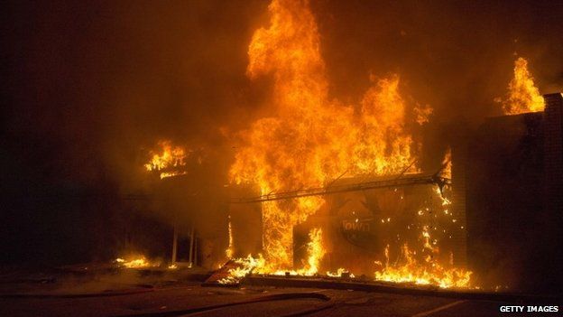 A business burns during rioting on November 24, 2014 in Ferguson, Missouri.