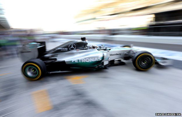 Lewis Hamilton leaves the garage