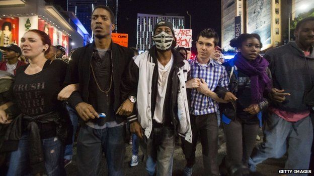 Demonstrators march on November 26, 2014 in Los Angeles during demonstrations against a decision by a Ferguson, Missouri grand jury to not indict a white police officer in the shooting of black teenager Michael Brown.