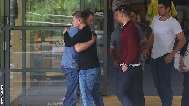 Players console each other at St Vincent's Hospital, Sydney. 27 Nov 2014