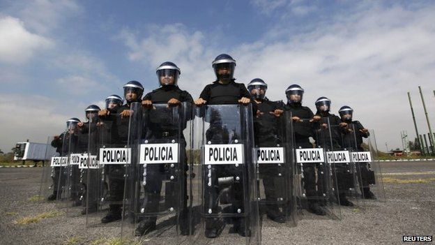 File photo: Members of the Task Force for Mexico City pose for a photograph at their base in Mexico City, 15 October 2014