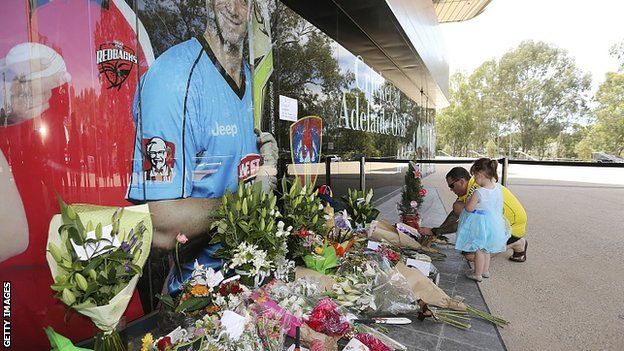 Flowers laid next to photograph of Phillip Hughes outside Adelaide Oval. 28 Nov 2014