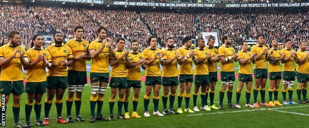 Australia's rugby team observe a minute's applause at Twickenham