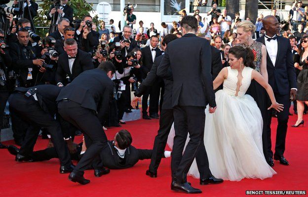 A man is arrested by security in Cannes
