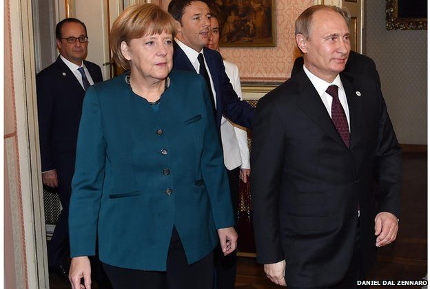 German Chancellor Angela Merkel, front left, Russian President Vladimir Putin, right, Italian Prime Minister Matteo Renzi, center, and French President Francois Hollande arrive for a meeting on the sidelines of the ASEM summit of European and Asian leaders in Milan, northern Italy, Friday, Oct. 17, 2014