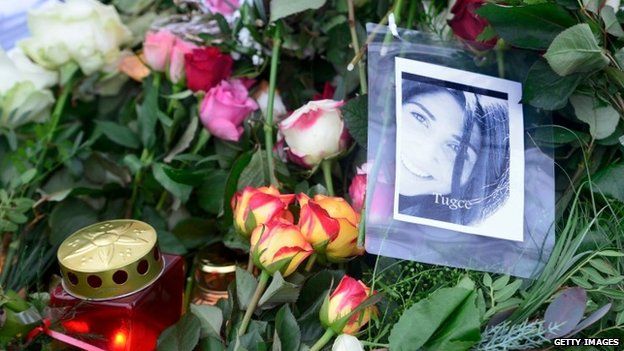 A picture of Tugce and flowers pictured at the grave of Tugce Albayrak