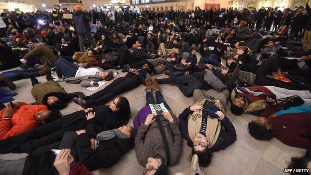 Protesters lay down in New York's Grand Central Station after the announcement that a police officer will not face charges