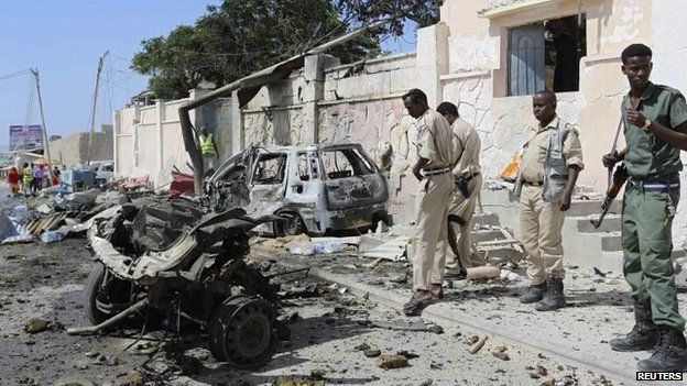 Somali security stand at the scene of an explosion in front of the airport in Somalia"s capital Mogadishu, 3 December 2014