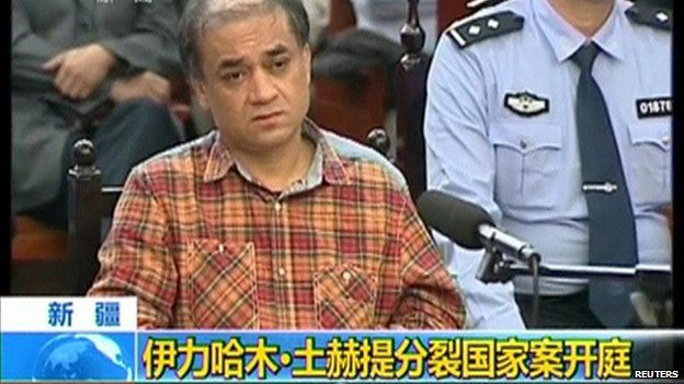 Uighur academic Ilham Tohti sits during his trial on separatism charges in Urumqi, Xinjiang region, in this still image taken from video shot on 18 September, 2014