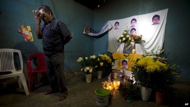 Ezequiel Mora stands next to an altar in his son's memory on 7 December, 2014