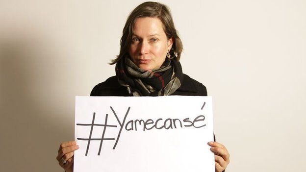 Woman holds #Yamecanse slogan