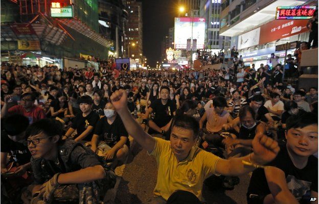 Thousands of pro-democracy protesters gather at Hong Kong's Mong Kok district Monday, Sept. 29, 2014