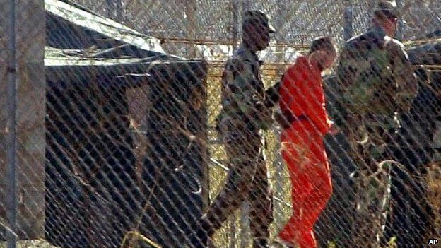 Prisoner being moved at Guantanamo detention centre, 2002