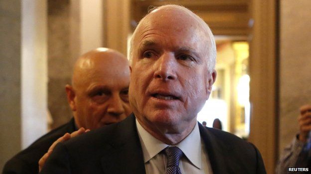 Senator John McCain leaves after Senator Dianne Feinstein's (D-CA) speech on the Senate floor on Capitol Hill, in Washington (9 December 2014)