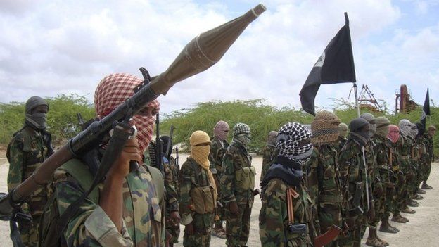 Al-Shabaab fighters display weapons as they conduct military exercises in northern Mogadishu, Somalia.