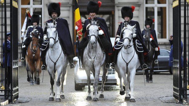 The cortege of late Belgian Queen Fabiola is escorted by mounted Royal Guards as it leaves Brussels Palace