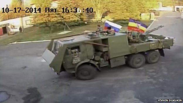 CCTV image of men on an armoured truck