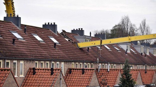 A crane which fell into the roof of a house in the Netherlands