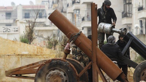 Rebel fighters prepare to launch a locally made shell towards forces loyal to Syria's President Bashar al-Assad at the frontline in al-Breij district of Aleppo