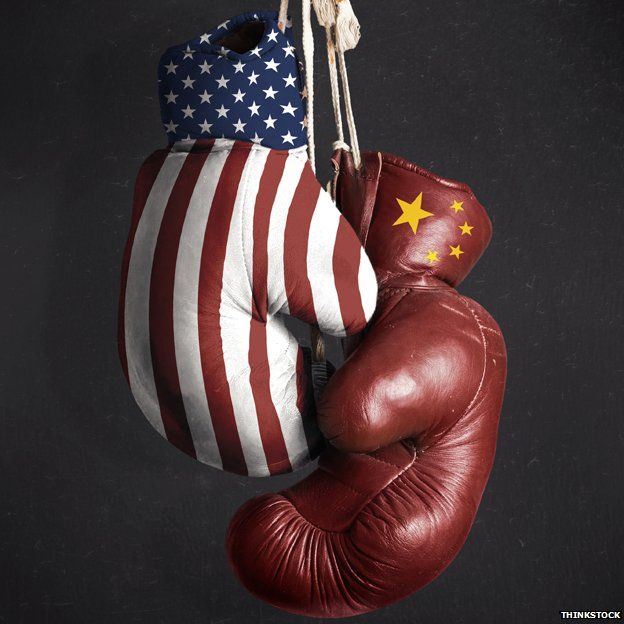 Two boxing gloves - one with the US flag and the other with the Chinese flag