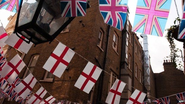 Cross of St George and Union Jack flags outside a London pub