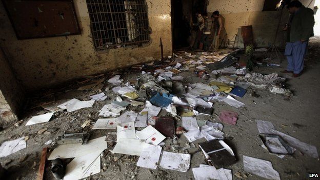 Pakistani security officials inspect the premises of Army Public School that was attacked by the Taliban militants in Peshawar, Pakistan, 17 December 2014.