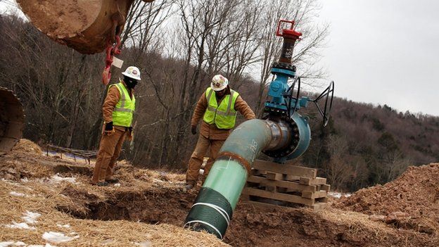 Two men at work at a hydraulic fracturing site in Pennsylvania