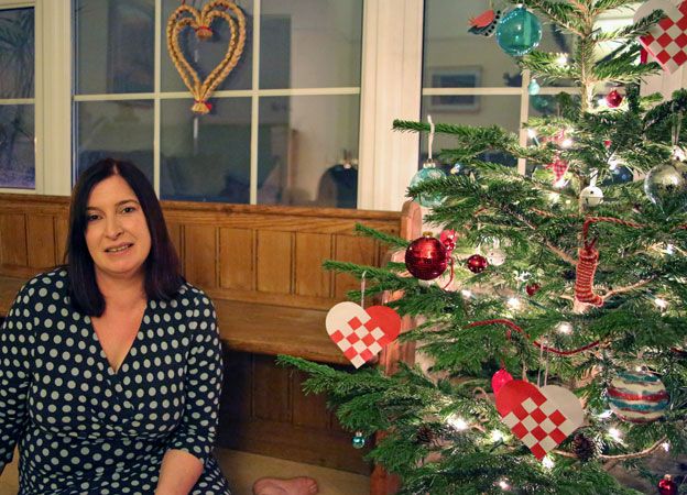 Charlotte in front of her tree