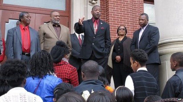 George Frierson, centre, tells a crowd he won't stop fighting to exonerate George Stinney, at a rally calling for justice in Manning, South Carolina 10 December 2013