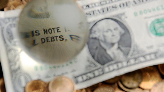 debts highlighted on dollar note