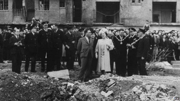 Queen Elizabeth in the East End of London stopping at Vallance Road, Stepney following an air raid during World War Two